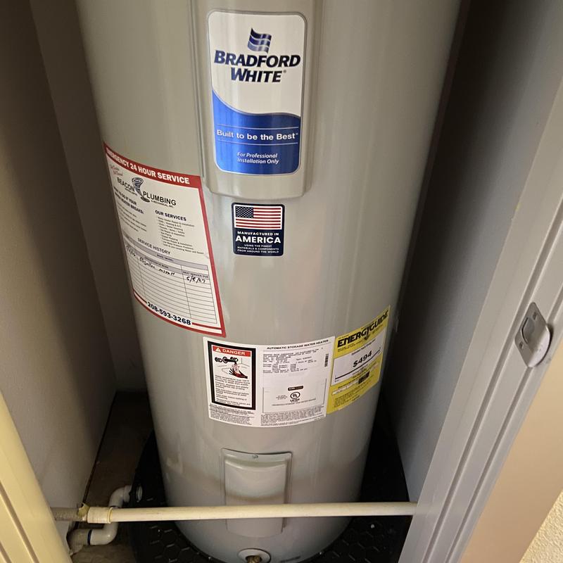 Water heater Bradford White with service tags and labels