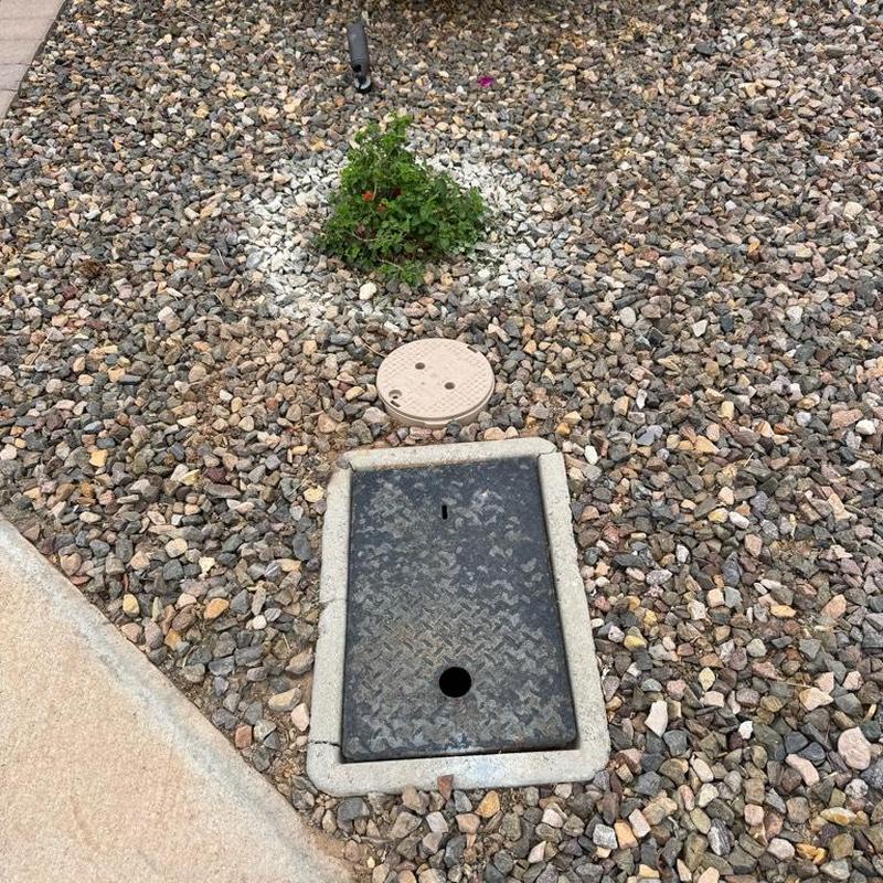 Irrigation valve boxes installed and covered with rock