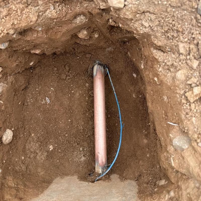 Copper water main pipe exposed for PRV installation