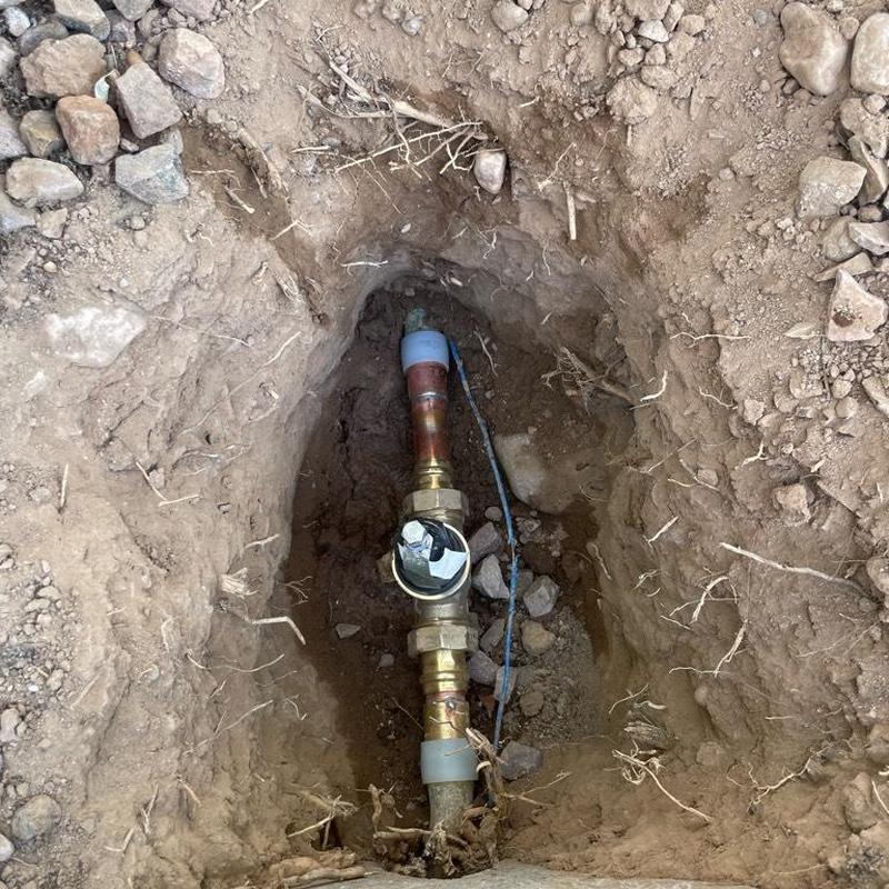 1-inch PRV on main waterline with access box in dirt
