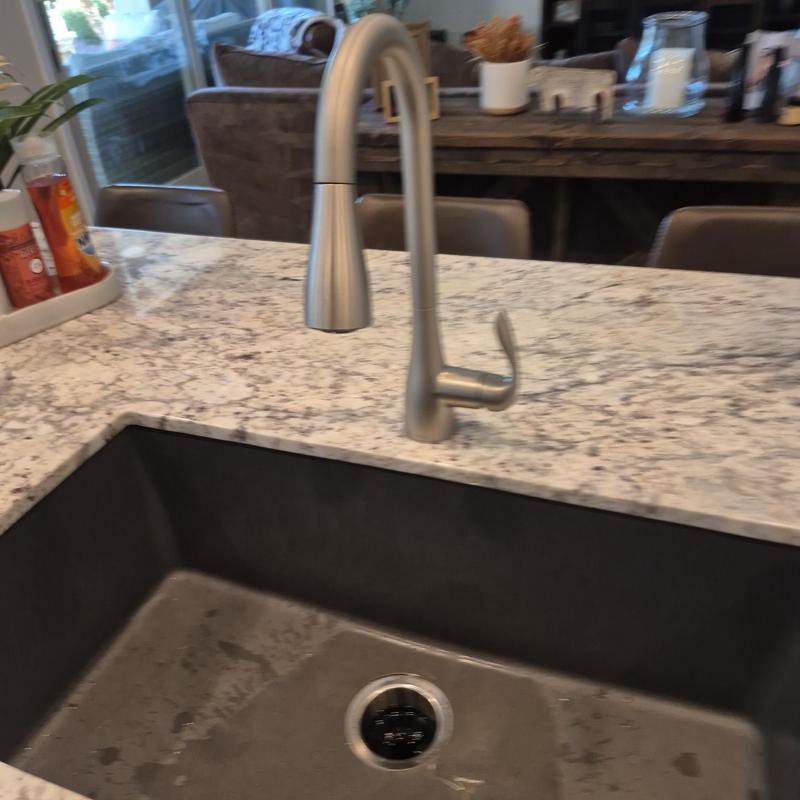 Kitchen faucet with pull-down spray on granite countertop Kitchen faucet with pull-down spray on granite countertop
