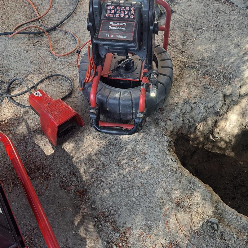 Cast iron pipe inspection camera near excavation site