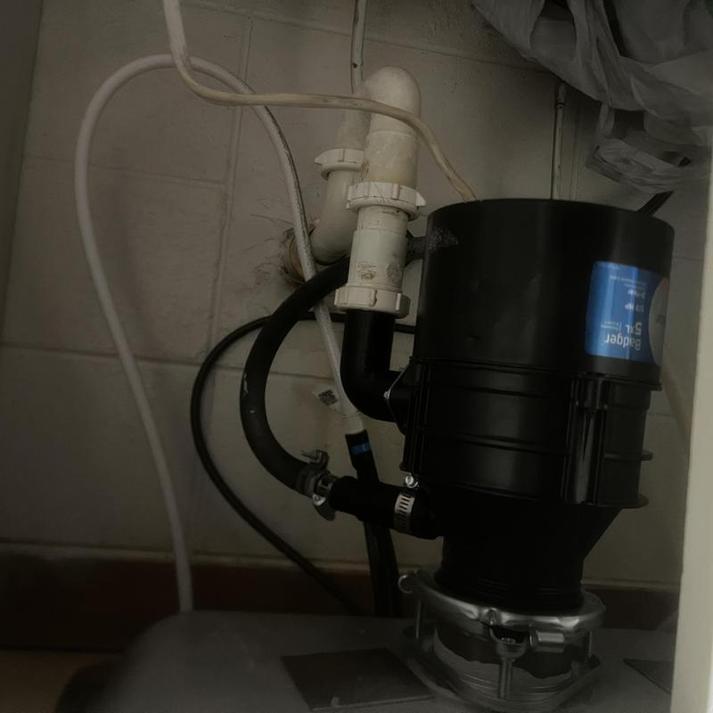 Garbage disposal unit with plumbing connections cleared