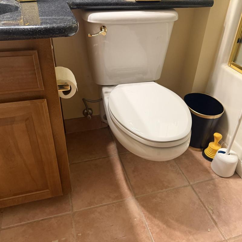 Toilet tank and bowl installation in bathroom corner Toilet tank and bowl installation in bathroom corner