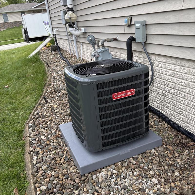Goodman outdoor AC unit on concrete pad Goodman outdoor AC unit on concrete pad