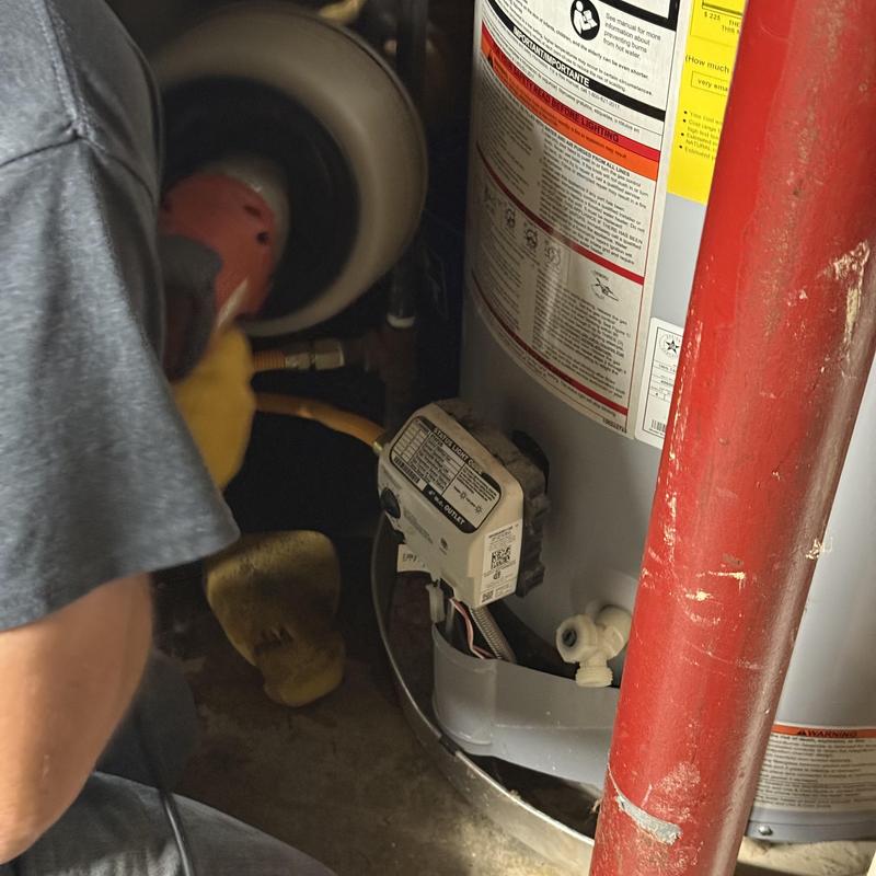 Water heater drain line clearing in basement Water heater drain line clearing in basement