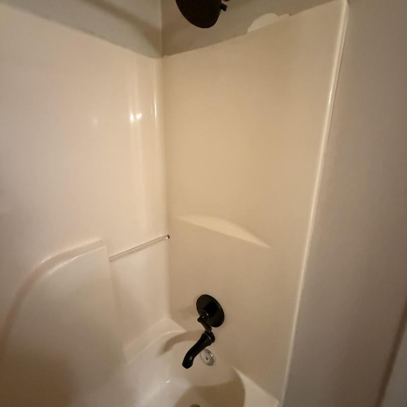 Delta tub shower valve and trim in bathtub enclosure Delta tub shower valve and trim in bathtub enclosure