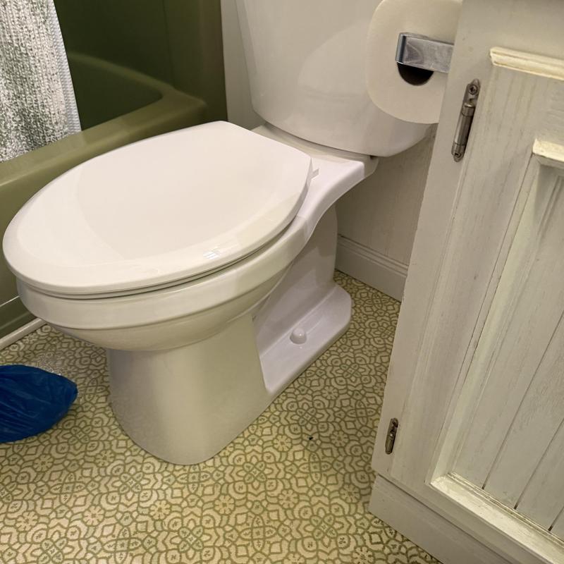 Gerber Elite toilet installation in bathroom corner Gerber Elite toilet installation in bathroom corner