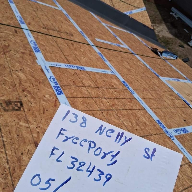 Secondary water barrier seam tape on roof decking Secondary water barrier seam tape on roof decking