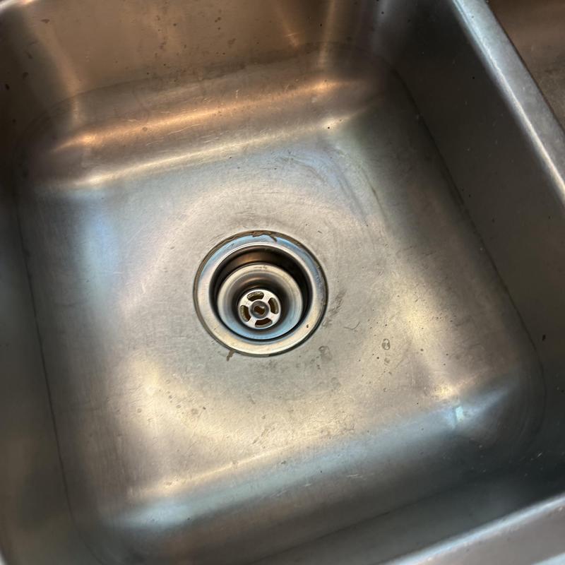 Kitchen sink basket strainer in stainless steel sink Kitchen sink basket strainer in stainless steel sink