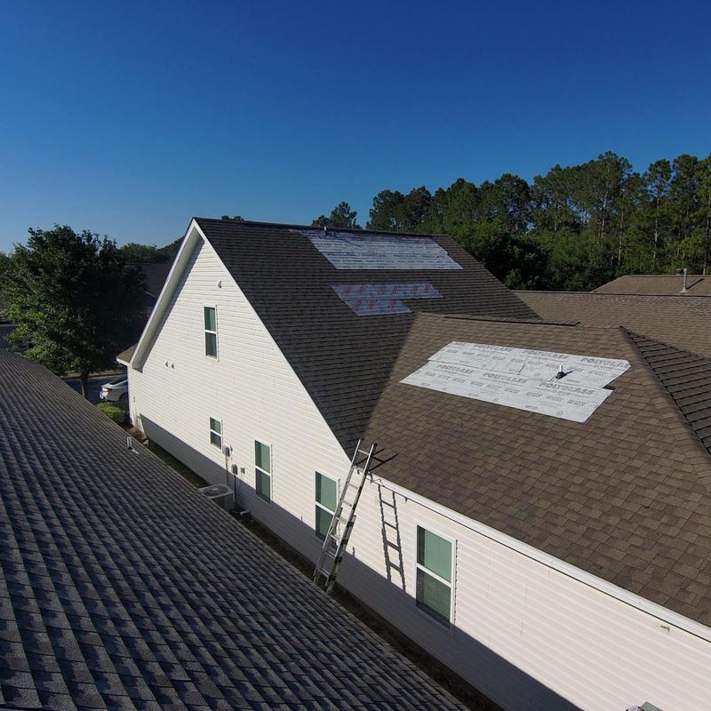 Roof shingles with temporary protective covering Roof shingles with temporary protective covering
