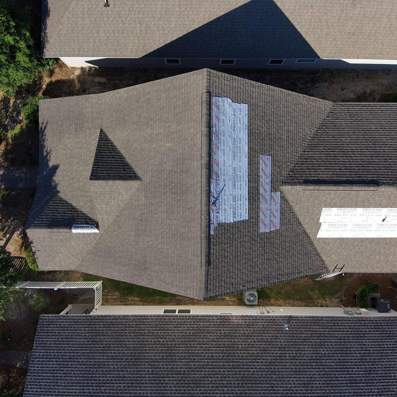 Roof shingles with temporary repair tarps installation Roof shingles with temporary repair tarps installation