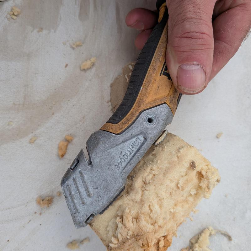 TPO roof insulation scraper removing foam material TPO roof insulation scraper removing foam material