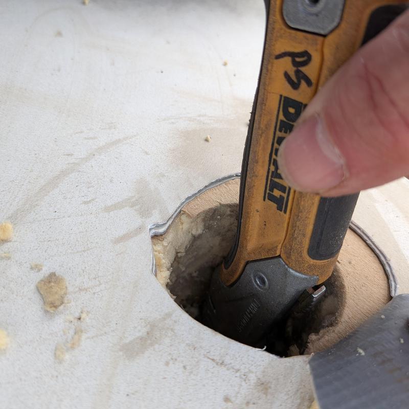 TPO roof drain opening with utility knife blade TPO roof drain opening with utility knife blade