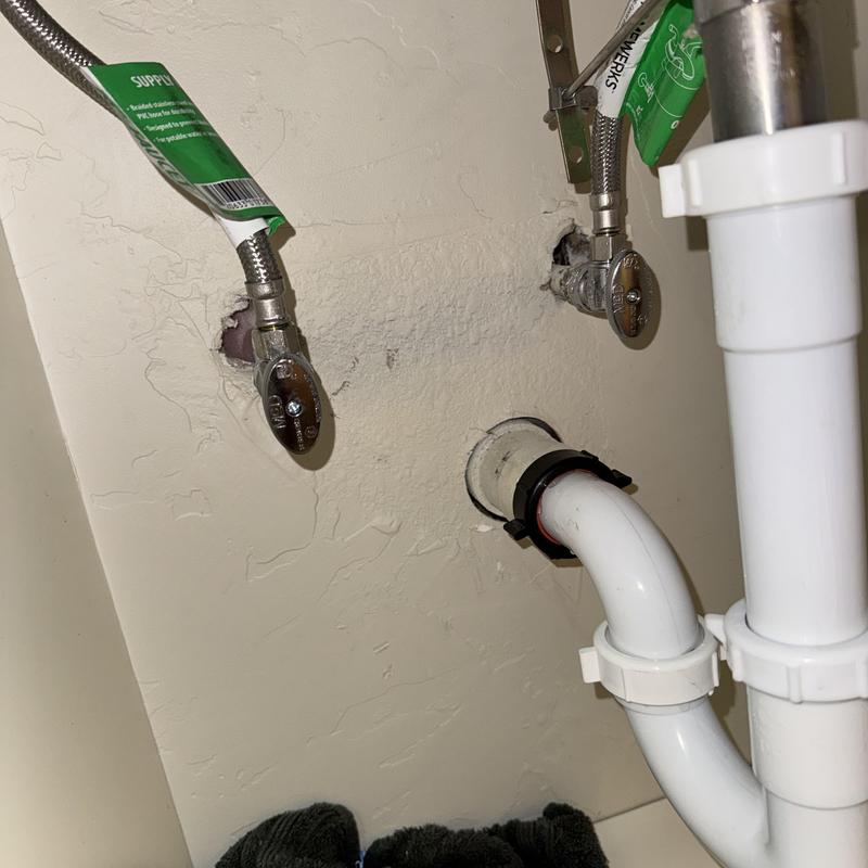 Angle stop valves and plumbing supply lines under sink