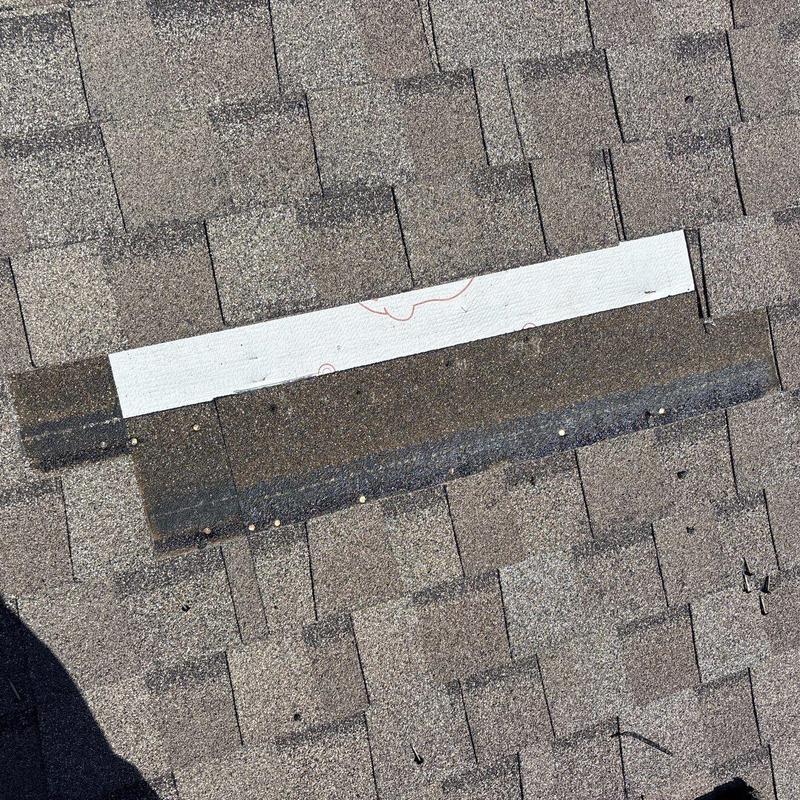 Asphalt shingles with hail damage and seal patch