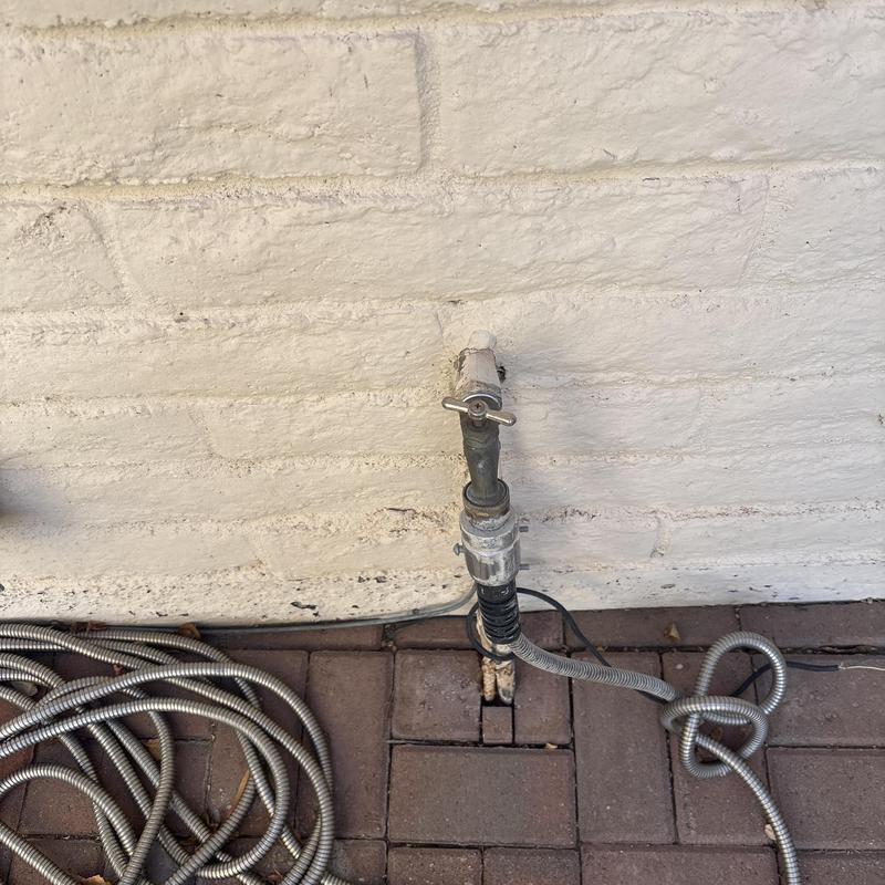 Outdoor hose bib with attached metal hose Outdoor hose bib with attached metal hose