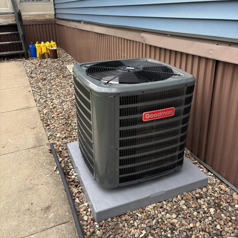 Goodman AC unit outdoor installation on stone bed Goodman AC unit outdoor installation on stone bed