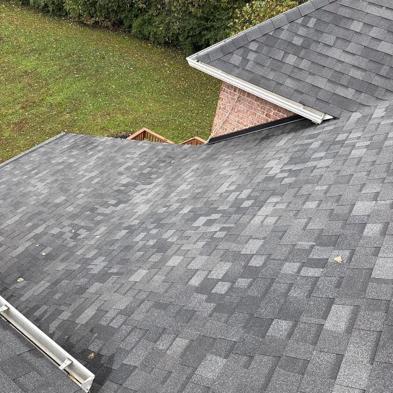 Asphalt shingle roof with hail damage inspection