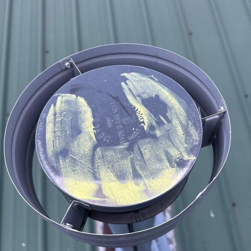 Roof ventilation system turbine showing hail damage marks