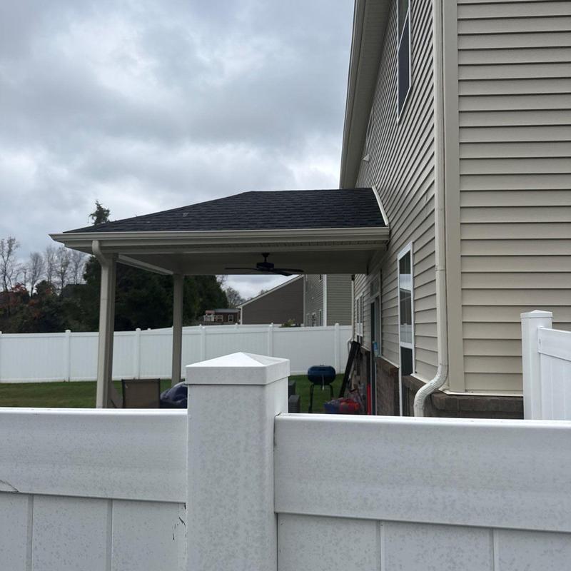 Patio roof shingles and gutter downspout system