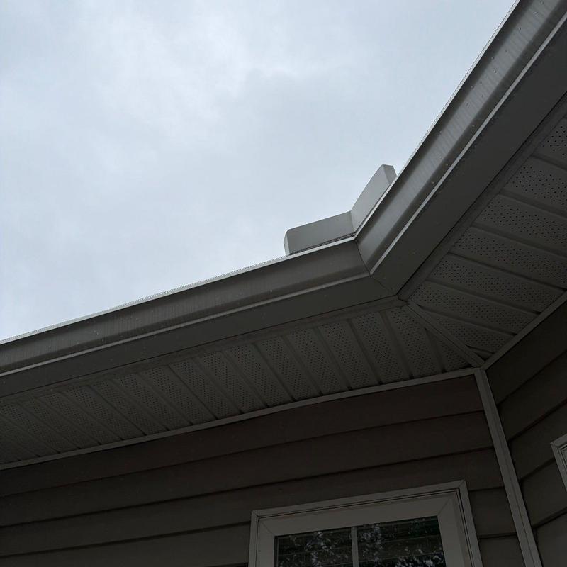 Aluminum gutter and roof flashing on residential home