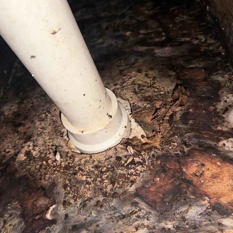 PVC pipe base with extensive wood rot damage