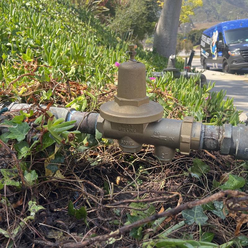 Pressure regulator valve on outdoor plumbing line Pressure regulator valve on outdoor plumbing line