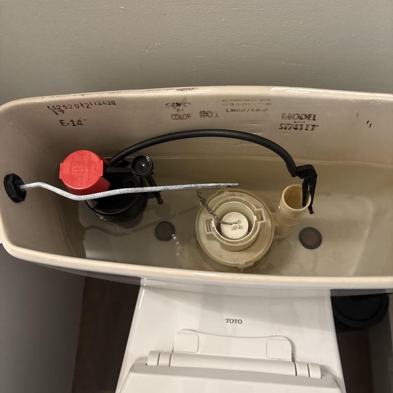 Universal toilet fill valve inside tank with water Universal toilet fill valve inside tank with water