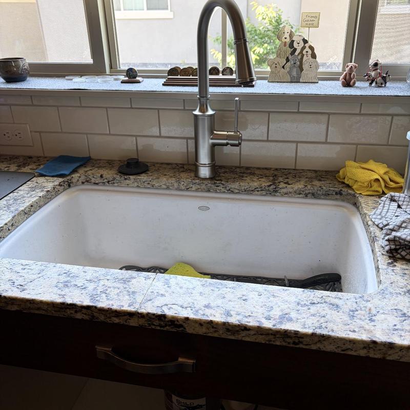 Kitchen faucet with stainless steel sink and granite counter
