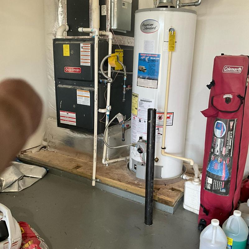 Water heater heat sensor reset in utility room