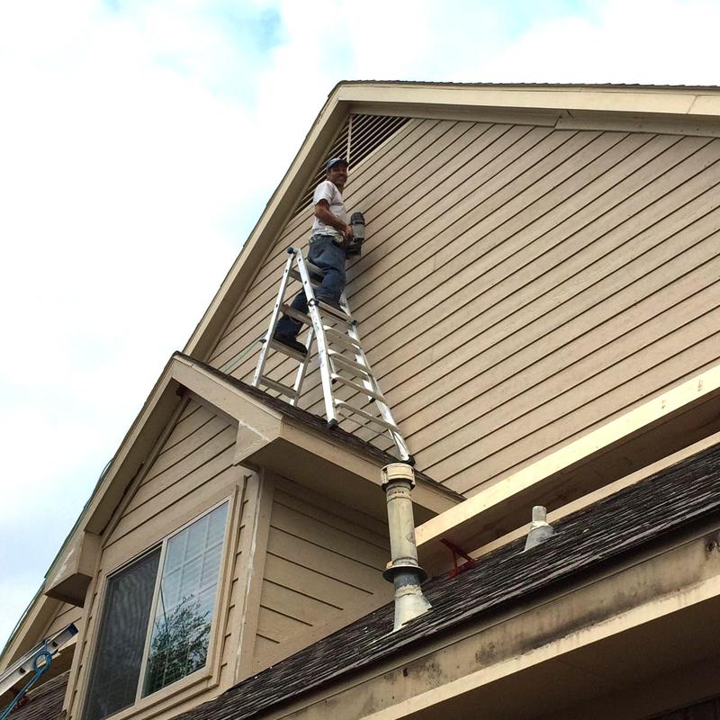 LP SmartSide lap siding and trim installation on house exterior LP SmartSide lap siding and trim installation on house exterior