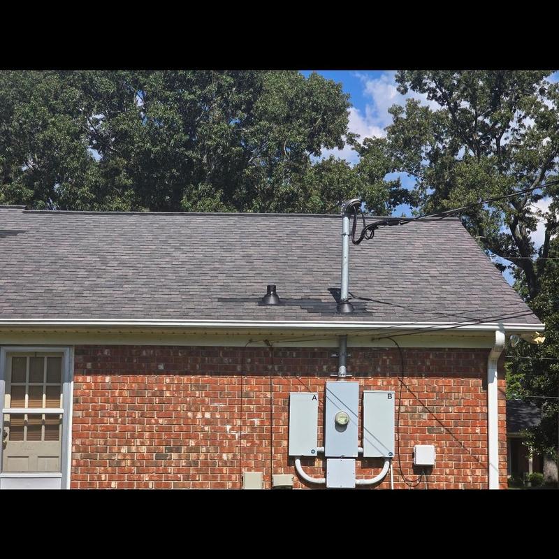 Shingle roof with replaced pipe boots on brick house Shingle roof with replaced pipe boots on brick house