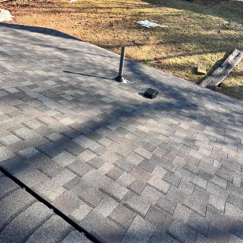 Asphalt shingle roof with vent and flashing near lawn Asphalt shingle roof with vent and flashing near lawn