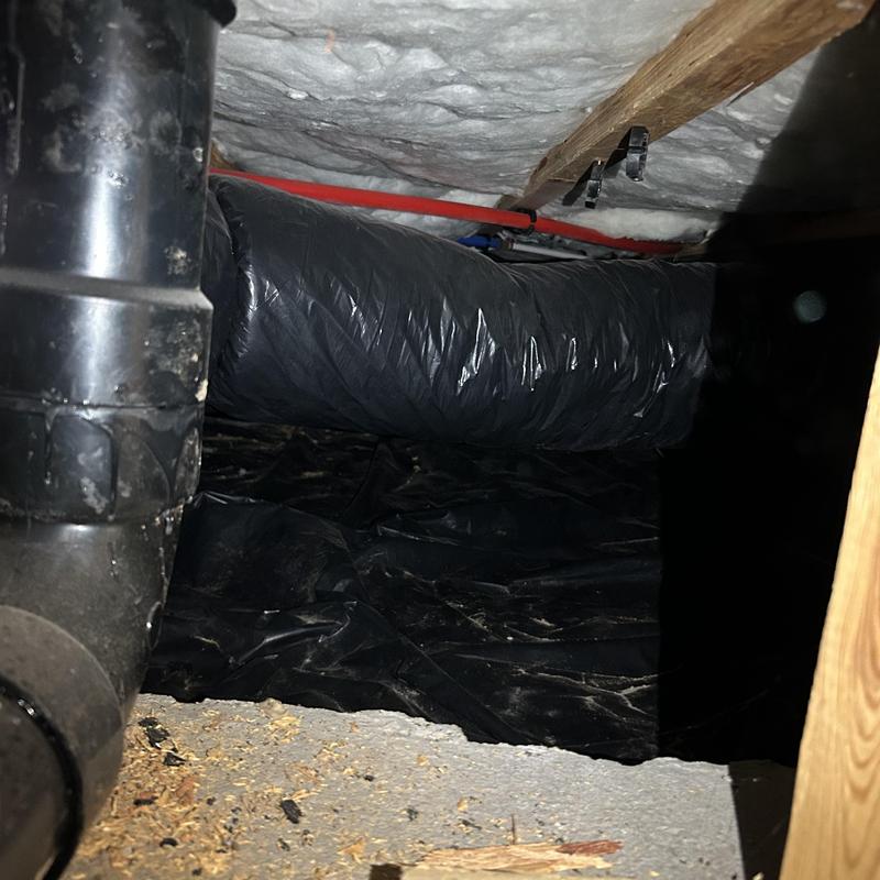 Toilet drain pipe and insulated duct in crawl space