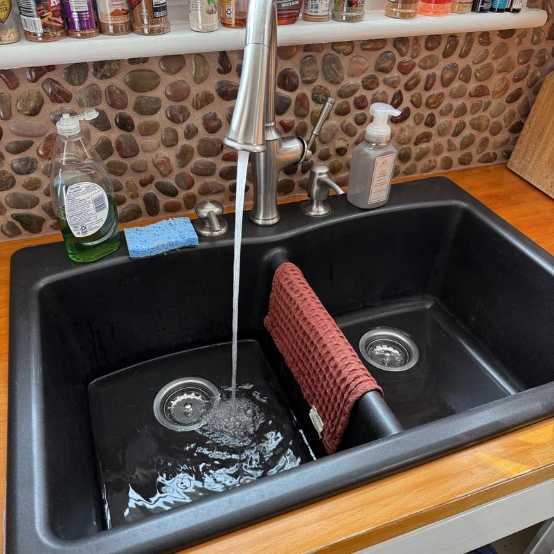 Kitchen sink faucet and basin with running water Kitchen sink faucet and basin with running water