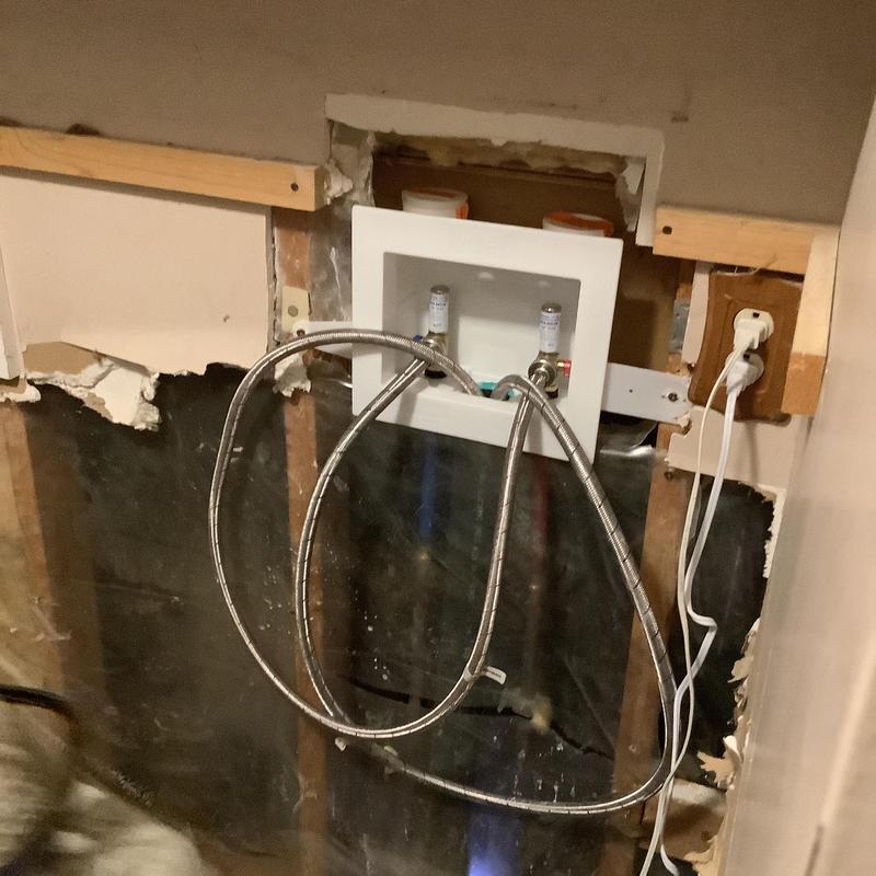 Washing machine box with supply hoses in wall cavity Washing machine box with supply hoses in wall cavity