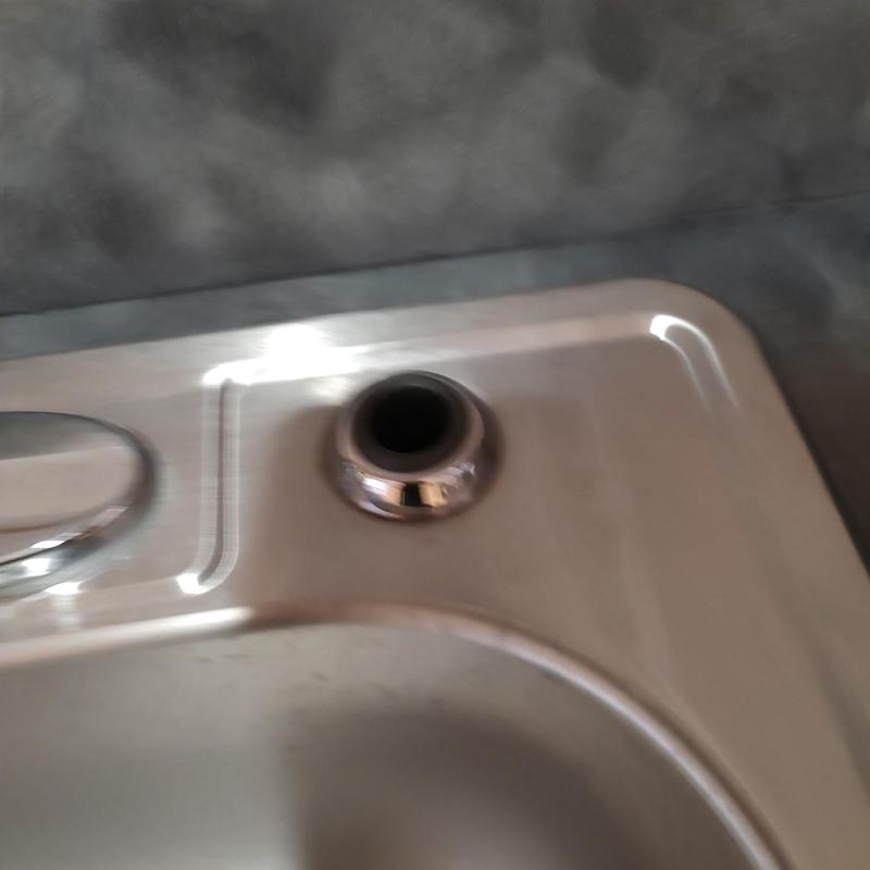 Delta kitchen sink sprayer hole on stainless steel sink Delta kitchen sink sprayer hole on stainless steel sink