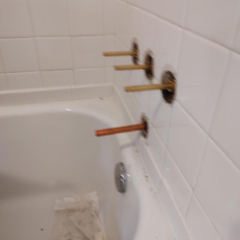 Central Brass 3-handle tub faucet stems in tub wall Central Brass 3-handle tub faucet stems in tub wall