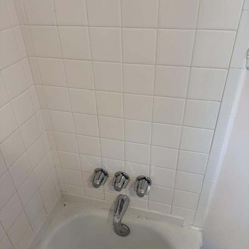 Central Brass 3-handle tub faucet installed in white tile Central Brass 3-handle tub faucet installed in white tile