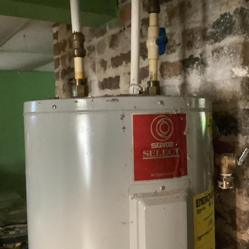 Electric water heater with piping and valves installed Electric water heater with piping and valves installed