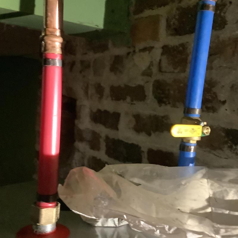 Electric water heater piping with shutoff valve in basement Electric water heater piping with shutoff valve in basement