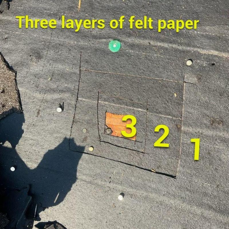 Multiple layers of felt roofing paper removed