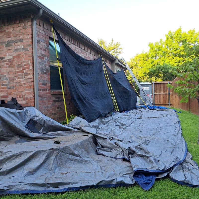 Roof debris tarps and mesh protection setup