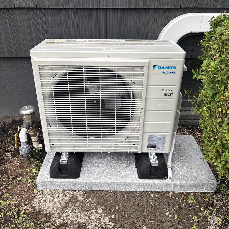 Daikin Aurora outdoor condenser unit on pad Daikin Aurora outdoor condenser unit on pad