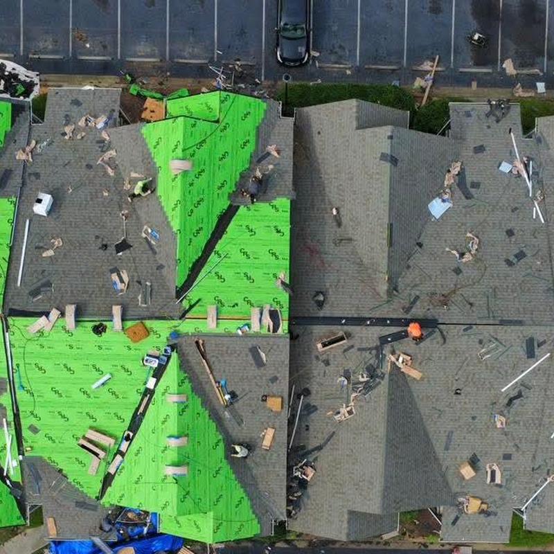 Asphalt roofing installation with green underlayment