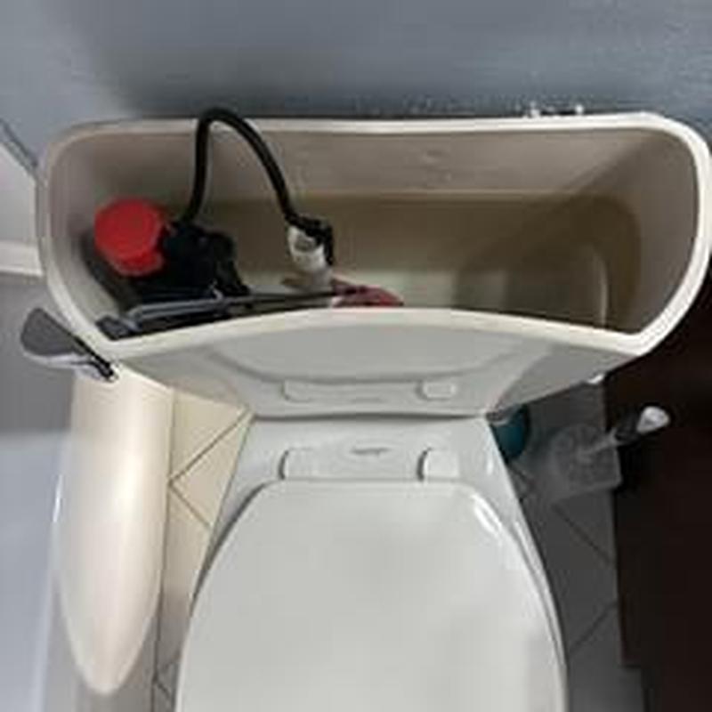 Toilet tank with fill valve and flapper components