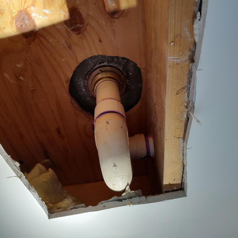 Fiberglass shower drain pipe with flange in wall cavity Fiberglass shower drain pipe with flange in wall cavity