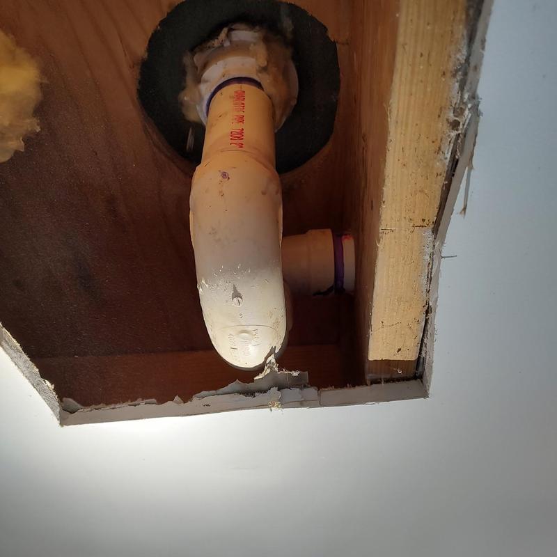 Shower drain pipe in ceiling cavity mid-repair Shower drain pipe in ceiling cavity mid-repair