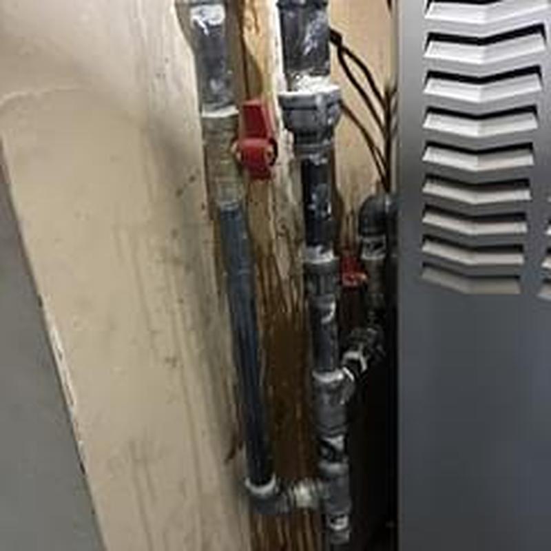 Gas supply pipes with valves near furnace unit